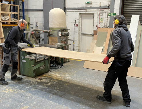 PDS In house workshop team using a tablesaw