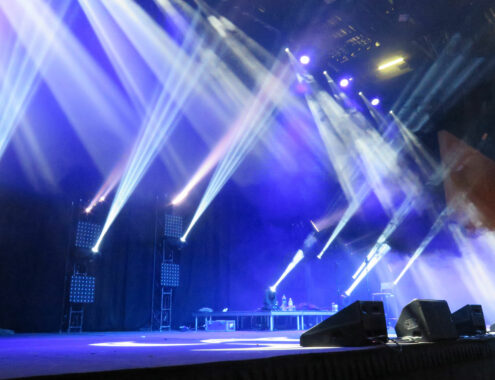 Empty stage illuminated by an array of lights