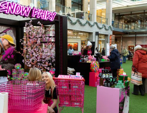 Lush snow fairy pop-up shop with smiling staff and customers
