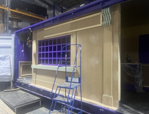 Shipping container being painted on.